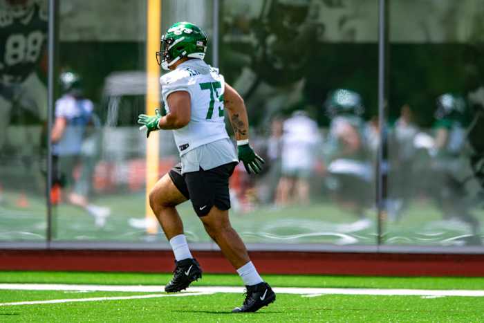 OL Alijah Vera-Tucker jogs at OTAs in 2021